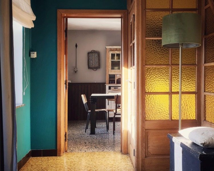 Bright passageway in Au Foyer, vacation home in the Ardennes, overlooking dining area.