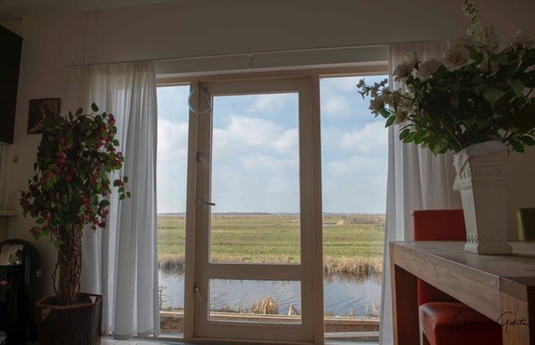 Sfeervolle slaapkamer in Huisje in Landsmeer, vakantieaccommodatie in Amsterdam eo, Noord-Holland.