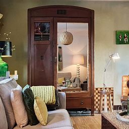 Comfortable sitting area in Au Foyer, vacation home in the Ardennes, with warm atmosphere.