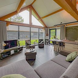 Modern living room in Villa de Argento vacation home, Alphen, North Brabant.