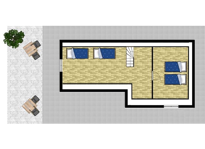 Gezellige woonkamer in vakantiehuis Sonja, Texel met comfortabele rode bank.