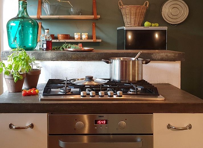 Comfortable sitting area in Au Foyer, vacation home in the Ardennes, with warm atmosphere.