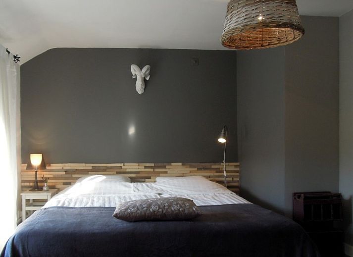 Comfortable sitting area in Au Foyer, vacation home in the Ardennes, with warm atmosphere.