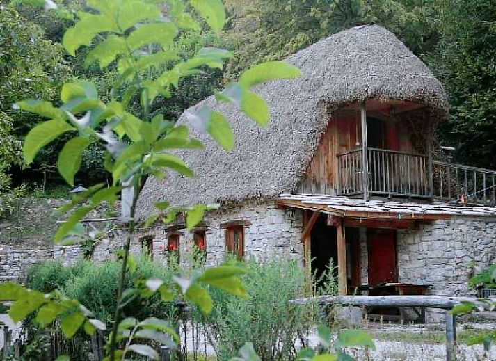 Rustic glamping lodge at Albero degli Alberi, surrounded by nature in Seren del Grappa, Veneto, Italy.
