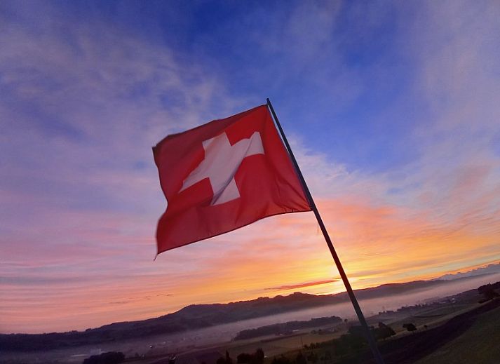 Vakantieverblijf Hauschen in Winikon, Centraal Zwitserland met prachtig uitzicht op groene tuinen.