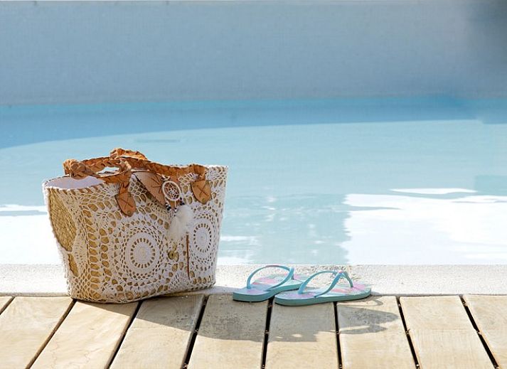 Casa A&K, vakantiehuis in Santa Eularia, Ibiza, biedt een sfeervolle woonkamer met karakteristieke inrichting en moderne voorzieningen.