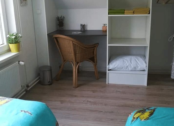 Gezellige woonkamer in Vakantiehuisje in Ottersum, Noord Limburg, met warme inrichting.