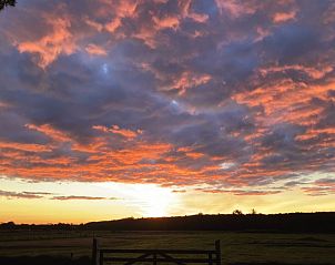 Adembenemende zonsondergang nabij Duinrand Vakantievilla's Type 1 in De Koog, Texel.