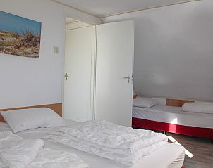 Gezellige slaapkamer in 't Langebosch vakantiehuis, Dennenbos, Texel voor een comfortabele nachtrust op de Waddeneilanden.