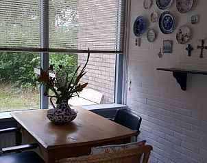 Cozy dining area in Anchorage bungalow, Midsland Noord, Terschelling, overlooking the garden.