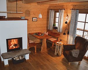 Wooden indoor room with fireplace in Holiday Home in Geiersthal/Altnuberg, Bavaria, ideal for relaxing evenings.