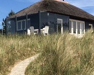 Charmante Parnassia vakantiehuis in de duinen van Nes, Ameland met panoramisch uitzicht.
