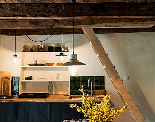 Authentic kitchen in Holiday cottage in Noailhac, Conques-en-Rouergue, with atmospheric wooden elements in Midi-Pyrenees, France.