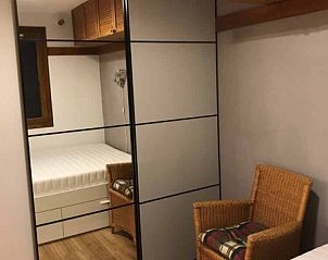 Stijlvolle slaapkamer in Residence Reine Blanche, Val Thorens, vakantieverblijf met luxe voorzieningen in de prachtige Franse Alpen.