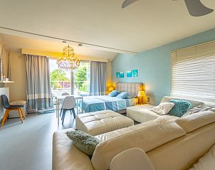 Ruime familiekamer in Vakantievilla De Witte Merel, Paal, Beringen, Limburg met balkon.