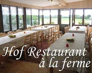Gezellig restaurant bij Villa & Gte Chavet in Amel, Ardennen, met uitzicht op de natuur.