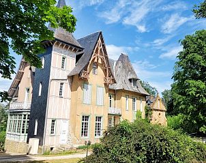 Side view of Chteau de la Barbiere, a charming cottage in Bouillon, Ardennes, with beautiful architecture.