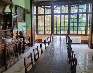 Elegant dining room with antique furniture in Chteau de la Barbiere, vacation home in Bouillon, Ardennes.