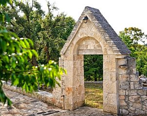 Authentic stone arch at Holiday Home in Ceglie Messapica, amid the serene nature of Apulia, Italy.