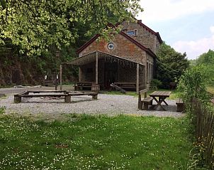 Enjoy peace and quiet at Cottage in Purnode, a charming cottage in the Ardennes, Belgium, with an inviting terrace and green surroundings.