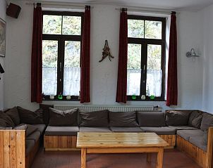 Cozy living room of Cottage in Purnode, cottage in the Ardennes, Belgium, with comfortable seating area and views of nature.