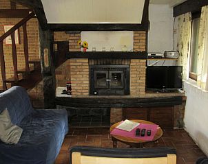 Cozy sitting area in Chouff cottage, Achouffe-Houffalize, with fireplace in the Ardennes, Luxembourg, Belgium.