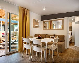 Comfortable dining room in Lopar Garden Home, Kvarner, Croatia with stylish decor and terrace view.