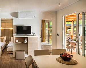 Stylish living room of Lopar Garden Home in Kvarner, Croatia overlooking the terrace.