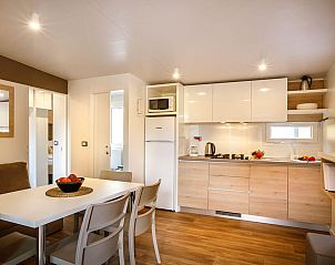 Cozy dining room and kitchen in Lopar Garden Home, vacation accommodation in Croatia.