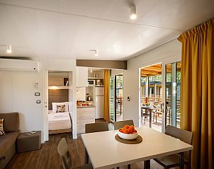 Modern living space in Lopar Garden Home, vacation home in Kvarner, with open kitchen and access to terrace.