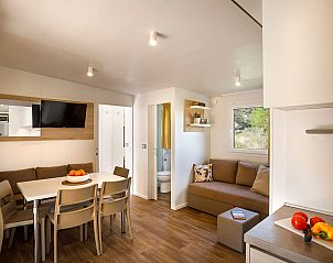 Stylish living room of Lopar Garden Home, vacation accommodation in Kvarner, with inviting seating and dining area.