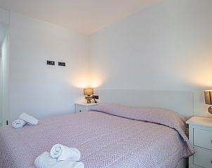Knusse slaapkamer in Alexia II vakantieappartement, Calpe, Spanje, met comfortabele inrichting en warme ambiance.