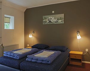 Gezellige slaapkamer in Vakantiehuisje in Orvelte, ideaal voor een ontspannen verblijf in Midden Drenthe.