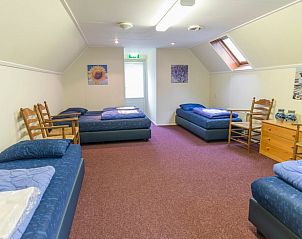 Gezellige groepsslaapkamer in Vakantiehuisje in Orvelte, perfect voor familie-uitjes in Drenthe.