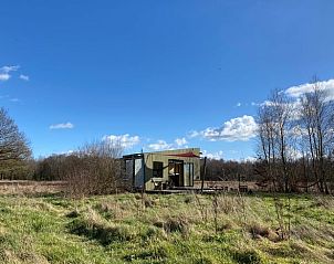Huisje in Mantinge, een vakantiehuis in Midden Drenthe, omgeven door weelderige natuur en open velden, ideaal voor natuurliefhebbers.