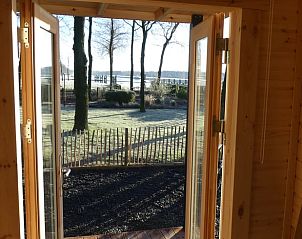 Uitzicht vanuit Vakantiehuis in Hoogeveen op groene omgeving en natuur in Drenthe.