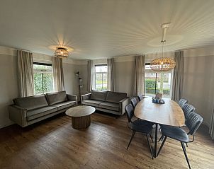 Cozy living room of Holiday Home Comfortable 8 in Bant, Flevoland with spacious seating area.
