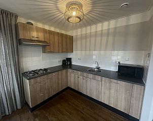 Modern kitchen in Holiday home Comfortable 8 in Bant, Flevoland with all amenities.