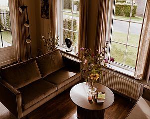 Intimate sitting area in Holiday Home Comfortable 8 in Bant, Flevoland overlooking the garden.
