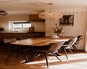 Spacious dining room in Holiday home Comfortable 8 in Bant, Flevoland with modern furnishings.