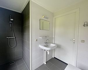 Luxury bathroom in Holiday Home Comfortable 8 in Bant, Flevoland with shower and sink.