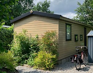 Exterior of the Holiday Home in Koudhoorn, Veluwe, surrounded by greenery.