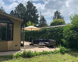 Garden and terrace at Holiday home in Koudhoorn, Veluwe, with green surroundings.