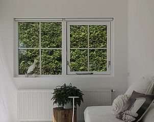 Zithoek in Vakantiehuis in Opende, Zuidwest Groningen met uitzicht op groene omgeving