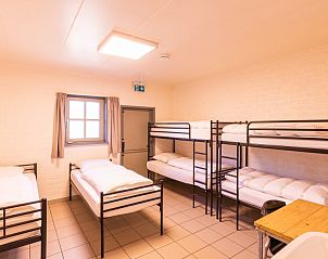 Gezellige slaapkamer in vakantiehuis De Schop, Hoogeloon, met comfortabele bedden en rustieke inrichting in de Kempen, Noord Brabant.