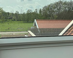 Uitzicht vanuit de slaapkamer van Huisje in Enschede, vakantieaccommodatie in Twente.