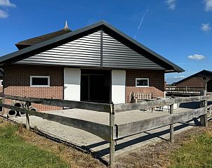 Grote gemeenschappelijke ruimte in Vakantiehuisje in Boskamp, Salland, Overijssel, met gezellige inrichting.