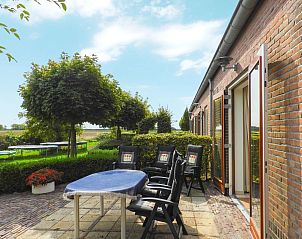 Sunny terrace at VZ526 Group accommodation Kattendijke in South Beveland.