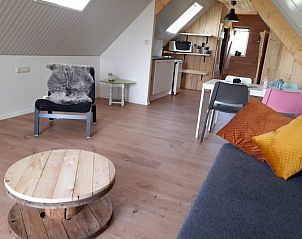 Open living space in Holiday home in BORSSELE, Borssele, Zeeland, with kitchen and sitting area for a cozy vacation.