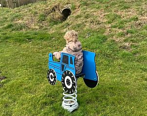 Playful tractor seesaw for children at vacation home in Borssele, Zuid-Beveland, perfect for a family vacation.